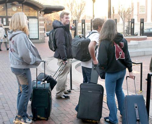 Christina M. Codini ’05, John F. Voith ’07, Michael A. Codini ’08 and Teresa M. Codini ’05 make for the Harvard Square T stop yesterday, taking leave of Harvard a day early for Thanksgiving break. 