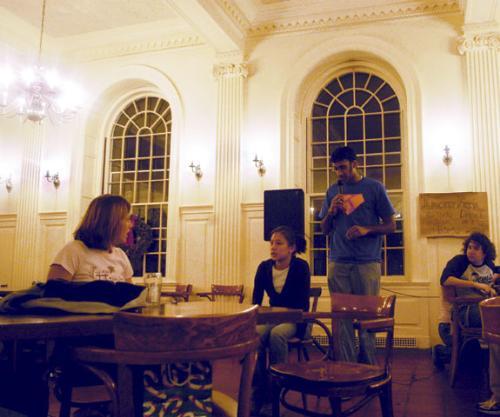 Navin Kumar ’06, right, serenades Anica Law ’06 during the final night of Kirkland’s annual Secret Santa celebration, which pairs up students within the house to present each other with holiday ‘gifts.’
