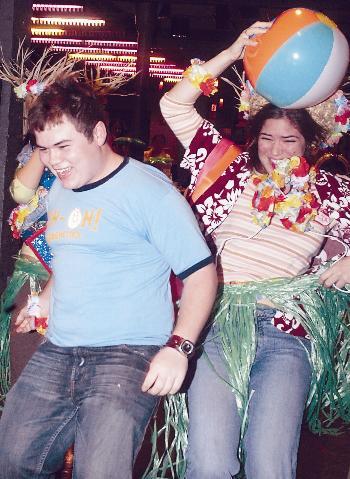 Josh D. Smith ’08 and prefect Maria M. Reyes-Bonar ’06 race at the Freshman luau study break last night in Loker Commons. The event was sponsored by the Prefect Program and UHS Wellness.