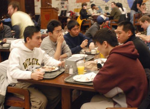Clockwise from left, Michael L. Nguyen ’08, Luke X. Li ’08, Dan T. Nguyen ’08, Ian D. Chong ’08 and Bobby X. Xu ’08 eat in Quincy dining hall. Quincy House residents complain that their dining hall is too crowded.