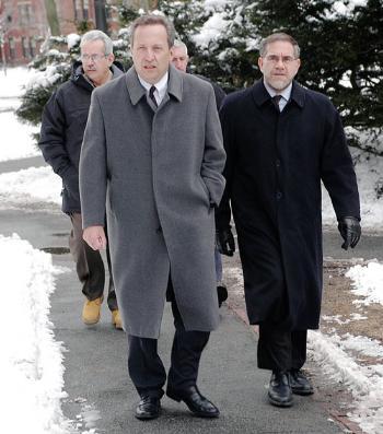 University President Lawrence H. Summers, left, and Provost Steven E. Hyman walk through Harvard Yard yesterday afternoon on the way to the Faculty meeting at Lowell Lecture Hall.