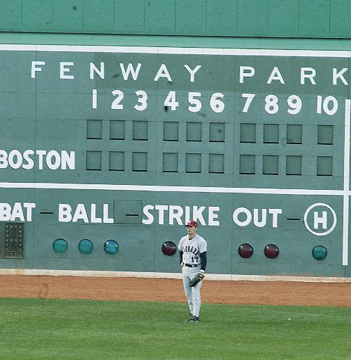 Senior outfielder W. Ian Wallace ’05 relaxes in left field at Fenway Park yesterday during Harvard’s 7-3 victory over Northeastern. With the convincing win, the Crimson took home its first Beanpot trophy since 1991. 
