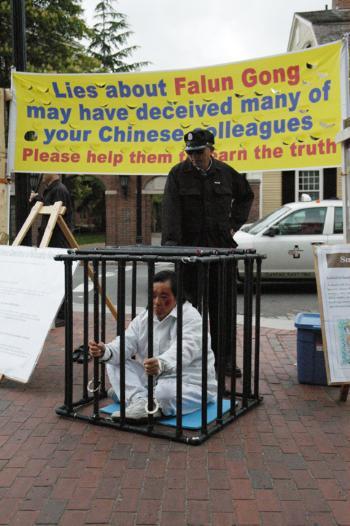 Falun Gong supporters donned costumes and facepaint in a demonstration on Mass. Ave. just outside Harvard Yard on Saturday afternoon.