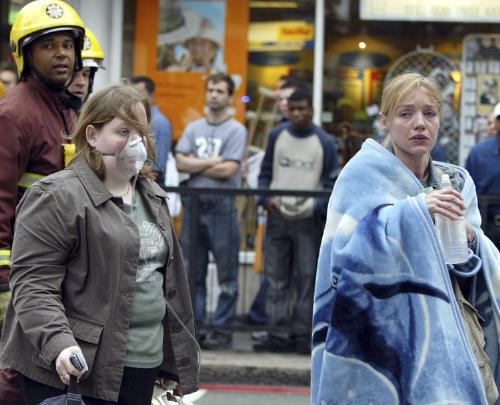 Injured tube passengers are escorted away from the Edgware Road Tube Station in London following an explosion yesterday morning.  Three blasts went off on the London subway and one went off on a double-decker bus.
