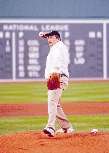 University President Lawrence H. Summers throws out the first pitch at the Yankees-Red Sox game last Friday. The Red Sox won, 17-1.