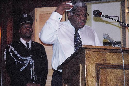 Levy P. Mwanawasa, President of Zambia, speaks to a packed crowd in a swealtering Kirkland Junior Common Room. He sat next to his wife after his speech and fielded questions from students.