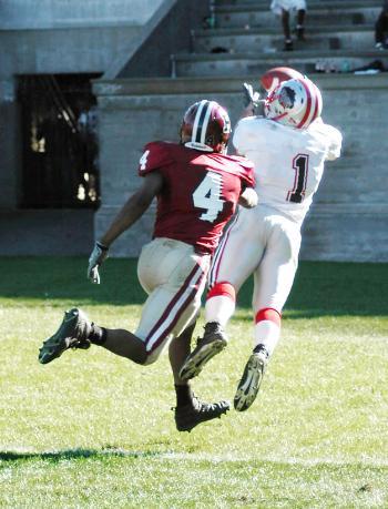 Brown wideout Jarrett Schreck, who had nine catches for 223 yards, reaches around Harvard cornerback Andrew Berry to haul in his second touchdown of the game, putting the Bears ahead 32-25 with 4:09 left.
