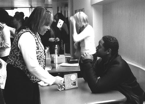 Blair Underwood signs copies of his new book, “Before I Got Here,” in Fong Auditorium in Boylston Hall Saturday afternoon. The actor and author talked about the book to a crowd of about 80.