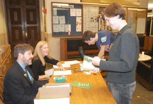 Brian P. Murphy ’86-’87, who is running for city council, and Lisa M. Boes, a resident tutor in Quincy, ask Zachary E. Hale ’06 and other Massachusetts residents to sign a petition for expanded health care.
