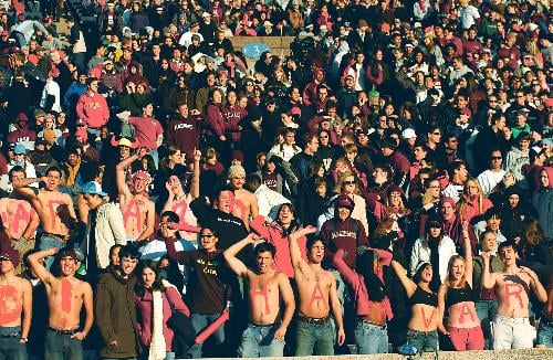 Harvard students show varying levels of support for the football team in proportion with their varying stages of undress. The temperature over the weekend hovered around 50 degrees Fahrenheit.