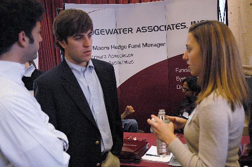Edward S. Segel ’06 and Ian B. McLean ’07 discuss summer internship possibilities at Bridgewater Associates with employee Kim Mattson at the Summer Opportunities Fair in the Gutman Library yesterday afternoon.