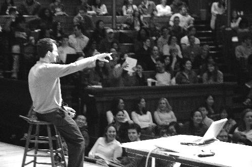 Ben-Shahar lectures to a packed house in Sanders Theater.