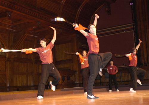 The Harvard Wushu Club strikes a pose during their broad sword routine at Saturday night’s Cultural Rhythms show in Sanders Theater.