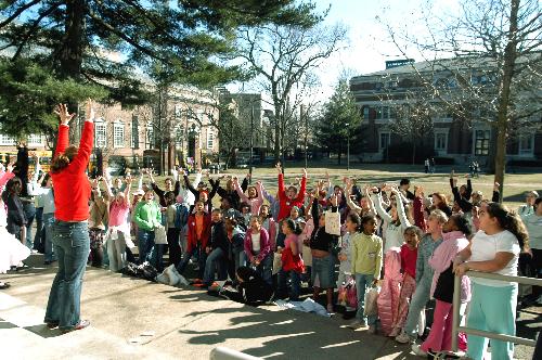 Megan E. Barragry ’07 led girls in a chant, “I am strong, I am proud, I’m not afraid to shout it loud—Strong Women Strong Girls!” on the steps of Robinson Hall on Saturday.