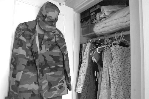 In Waterman's closet, full of flowered skirts and dresses, camouflage doesn't quite blend in.
