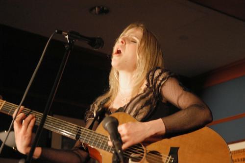 Katherine E. Fitzgerald ’09 rocks away during “Ostara 2006: Arts
Intertwined”, an event presented by the Women’s Leadership Network in
celebration of women in the arts at the Faculty Club.