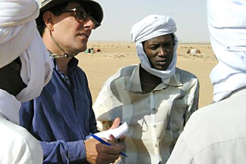 Nicholas D. Kristof '81-'82 talks with rebels in Darfur. He has worked to bring attention to the genocide occurring in Darfur.