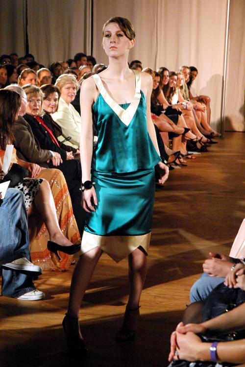 An über-stern model showcases a Lewis Albert Remele ‘06 dress during an October 2005 fashion show at Chateau Veronique in Brookline, Mass.