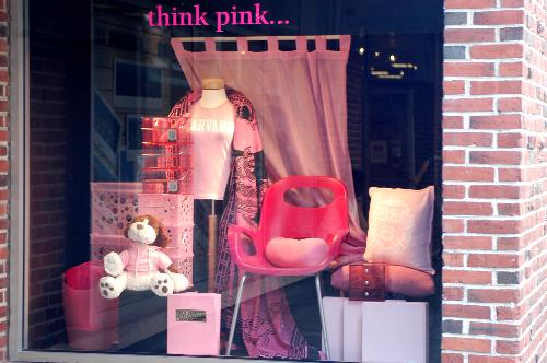 The Harvard Coop is promoting the Breast Cancer Awareness campaign with a pink window display.