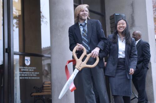 Ryan A. Petersen '08 cuts the ribbon for the Lamont Library Cafe opening yesterday afternoon. Students then flocked to the old reference space.