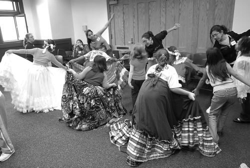 Members of Ballet Folklorico lead girls from several Boston-area elementary schools in an international dance workshop as part of Strong Women, Strong Girls’ Global Girls Day in Sever Hall, Saturday.