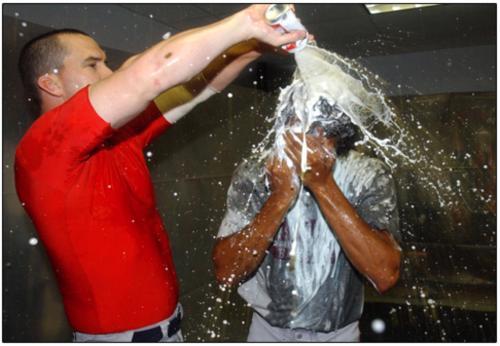 Kevin Millar douses Pedro Martinez after clinching a playoff berth in 2004.