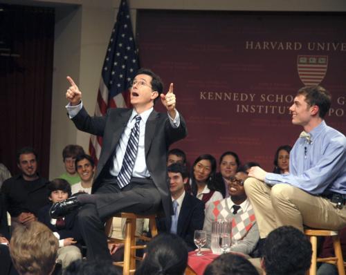 Stephen Colbert (left) works the crowd in a sold-out appearance at the John F. Kennedy, Jr. Forum on Friday night. Chris L. Corcoran '07 (right) interviewed Colbert and moderated during a question-and-answer session.