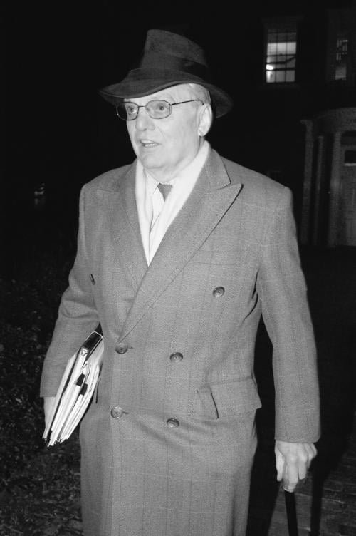 James R. Houghton ’58, chairman of the presidential search committee and senior fellow of the Harvard Corporation, walks out of Loeb House last night.
