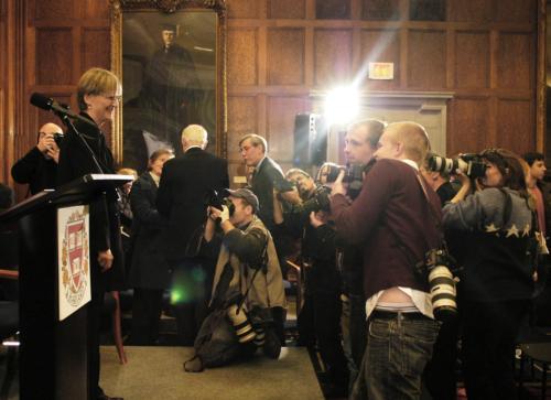 Drew Gilpin Faust stands before reporters, including representatives from The New York Times and USA Today, in the Barker Center’s Thompson Room.