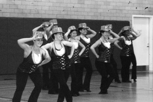 The Harvard Crimson Dance Team rehearses for a national competition in the Hemenway gymnasium. 