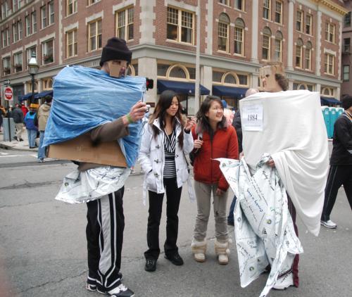 Slobodan Radoman ’07 and Karolis Balciunas ’08 talk to friends after finishing the Boston marathon in costume yesterday afternoon. 