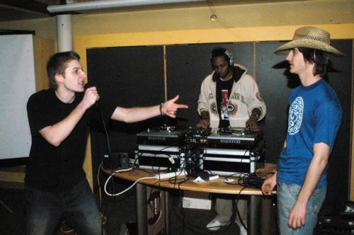 Lev. A Shaket '10 (left) performs at "Outwit: A Freestyle Competition" in Ticknor Lounge Saturday evening as William C. Quinn '10 a.k.a. "Jam Master Q" (right) looks on.