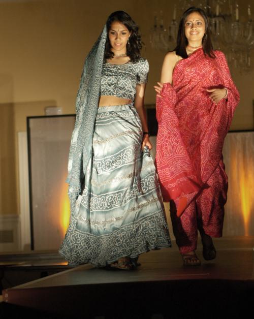 Aditi Sen ’09, left, and Mayuri N. Shah ’08 walk down the ramp at the South Asian Association’s fashion show “Andaaz” in Lowell dining hall Saturday evening.