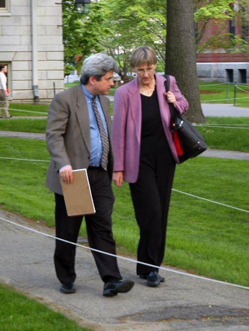 University President-elect Drew G. Faust walks with Secretary to the University Marc L. Goodheart '81 toward Mass. Hall after professors voted to approve a new general education curriculum for the College.