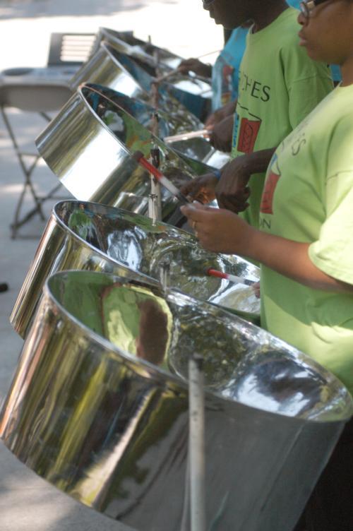 Members of Branches Pam-Groove Steel Orchestra perform a breezy rendition of "Sound of Silence" on the steps of Memorial Church on Wednesday. They were there for a Caribbean festival, as well as Harvard's annual Senior Picnic in Tercentenary Theater.
