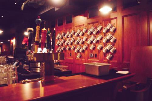 Steins adorn the walls of the Queen’s Head pub, where seniors with Upper Hall memberships will soon fill these mugs for free on select Fridays.