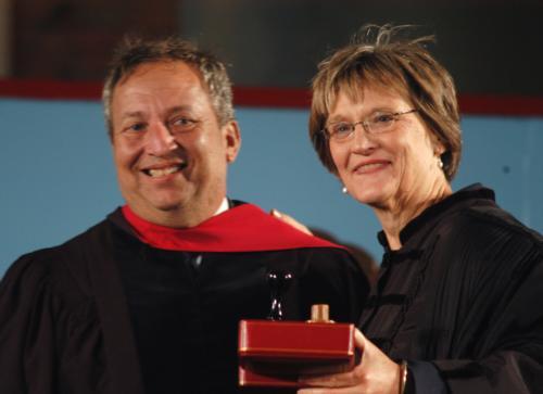 Former Harvard President Lawrence H. Summers presents a set of Veritas stamps to Drew G. Faust, who was installed as the University's 28th president on Friday.