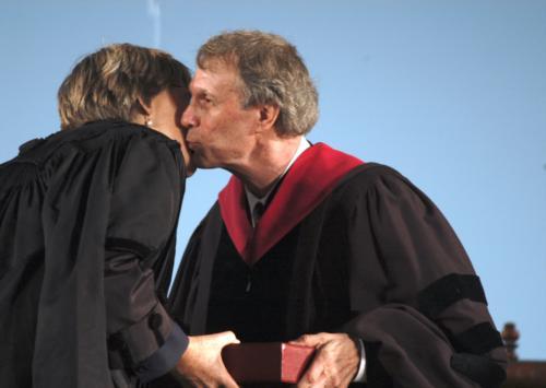Faust accepted the second of Harvard's illustrious insignia, a bound copy of official Harvard records dating from 1639 to 1795, from former Harvard President Neil L. Rudenstine. The compilation contains an original sketch of the famous "Veritas" insignia.