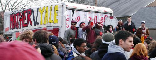 At the Mather/Currier House tailgate, Harvard undergraduates celebrate another tolling of the “Crunk Clock,” which incited students to drink every 30 minutes.