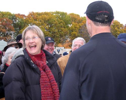 President Faust celebrates the
Crimson victory over Yale. She
spoke to Harvard coach Tim Murphy and other notables after the
game.