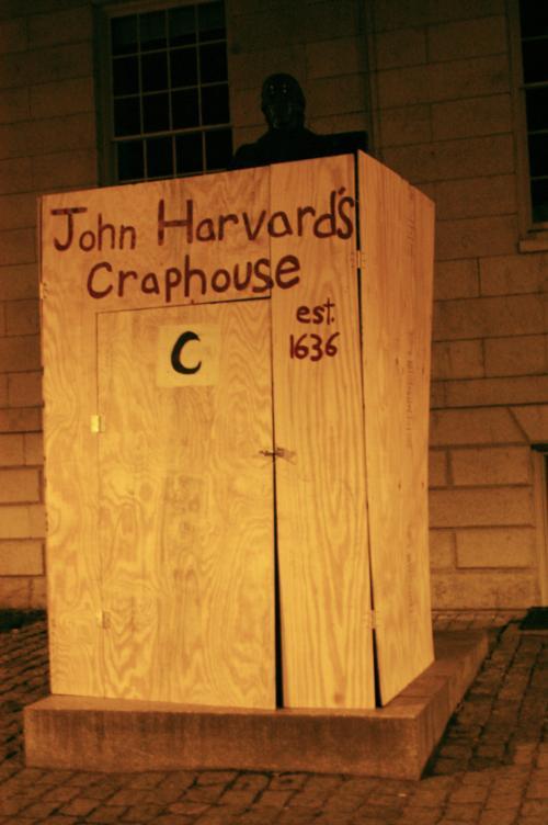 The John Harvard statue falls prey once again to pranksters who created an outhouse for the man whose library started the University.