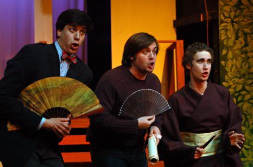 From left to right, Adam Goldenberg ’08, Brian C. Polk ’09, and Philipp W. Grimm ’11 play Pooh-Bah, Ko-Ko, and Pish-Tush in the Harvard-Radcliffe Gilbert and Sullivan Players’ “The Mikado.”