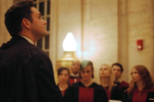 University Choir director Edward E. Jones reflects as the choir prepares in the Memorial Room just before the start of the 98th annual—America’s oldest—Christmas Carol Services at Memorial Church on Sunday.