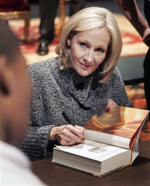 Author J.K. Rowling signs a copy of her book, "Harry Potter and the Deathly Hallows," in New Orleans in October.