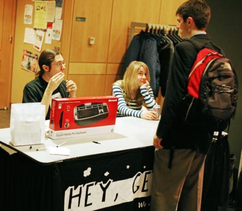 Abraham M. Passaglia ’08 and Kristen E. Lovin ’08, a former member of The Crimson’s business department,
discuss Microsoft’s “Hey Genius!” internship with a student at Microsoft TechFest, a recruiting event.