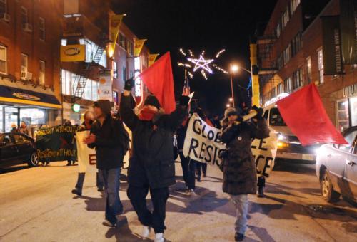 Demonstrators march along JFK street—starting from the IOP and heading toward the COOP—to protest a speech given by Mexican President Felipe Calderón at the John F. Kennedy, Jr. forum last night.
