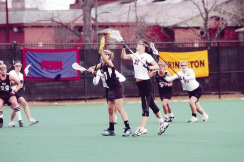 Co-captain Natalie Curtis, shown in earlier action, led the women’s lacrosse team in scoring yesterday against Albany, tallying four goals en route to a 16-10 Crimson victory. Harvard’s victory maintained its undefeated record. The squad now stands at 3-0