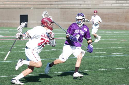 Sophomore midfielder Jason Duboe, shown here in earlier action, was the difference-maker for the Crimson, contributing to four of Harvard’s eight goals with a hat trick and an assist. The win brought the team’s record to 2-1 and avenged a hard-fought 11-1