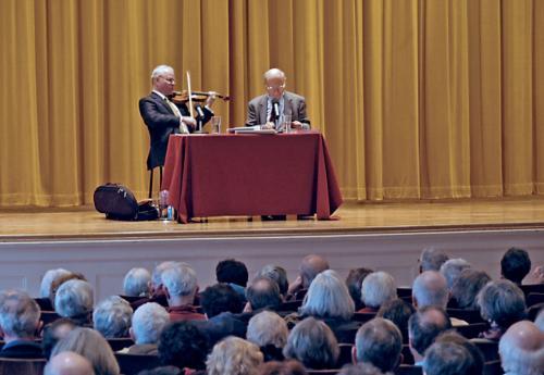 Music Professor Lewis H. Lockwood (right) and a member of the Julliard String Quartet give a lecture and demonstration on Beethoven’s string quartets in Paine Hall yesterday afternoon.
