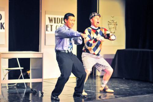 Yin Li ’08 and Matthew T. McClure ’09 strut their stuff in business attire and clashing golf gear in “How to Succeed in Business Without Really Trying.”